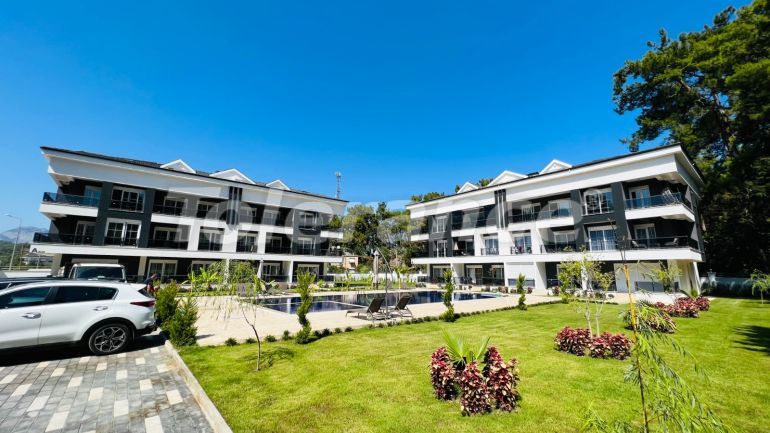 Квартира от застройщика в Арсланбуджак, Кемер с бассейном: купить недвижимость в Турции - 110946