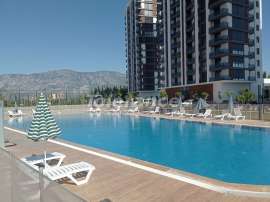 Квартира в Дошемеалты, Анталия с бассейном: купить недвижимость в Турции - 84352