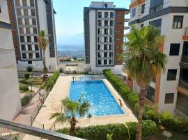 Квартира в Кепез, Анталия с бассейном: купить недвижимость в Турции - 98466